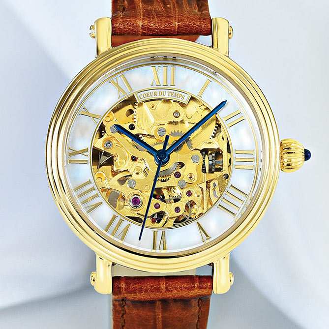 Reloj clásico de mujer Coeur du Temps: Corona con un zafiro auténtico y una curiosa forma estriada.