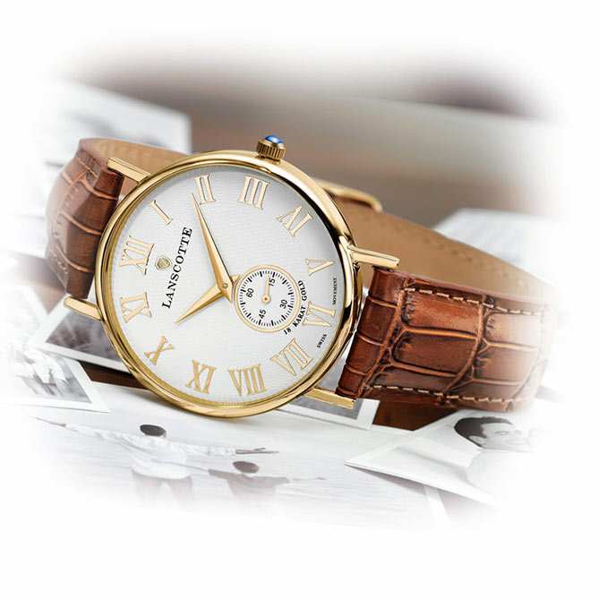 Reloj suizo de oro Legado: Corona en acero acabada en Oro de Primera Ley (IPG), adornada con un Zafiro auténtico tallado en cabujón.
